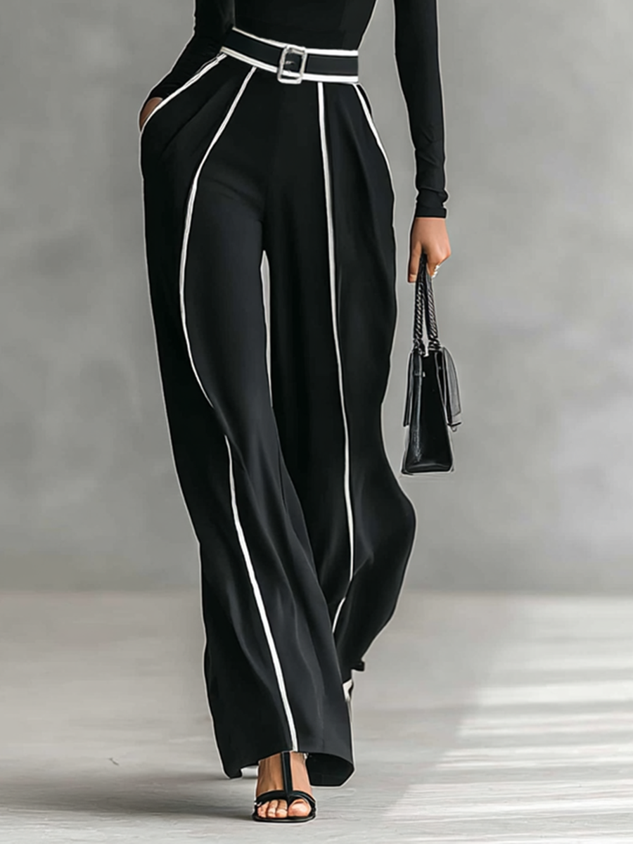 Two-piece ladies set with high neck top with long sleeves, wide trousers and belt