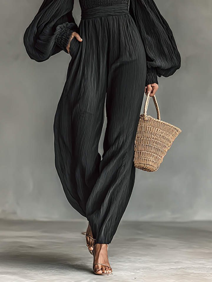 Ladies' pleated fabric jumpsuit with off-the-shoulder design and long sleeves